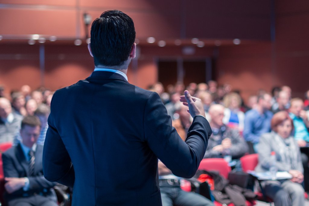 A person speaking to an audience